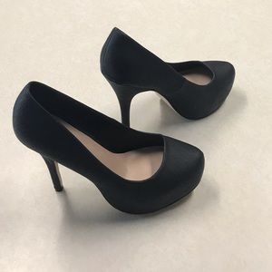 Black platform pumps